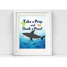 Load image into Gallery viewer, These jaw-some photo props will surely bring fun to your Shark Party Theme. You will receive a PDF file formatted on 8 ½&quot; X 11&quot; with 8 different Shark Photo Props. It also includes &quot;Take a Prop Shark a Pose&quot; Sign. Print as many copies as you desire then paste on dowel sticks.